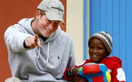 Prince Harry with African child